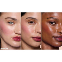 Model wearing plum-toned sheer blush and lip tint on cheeks and lips