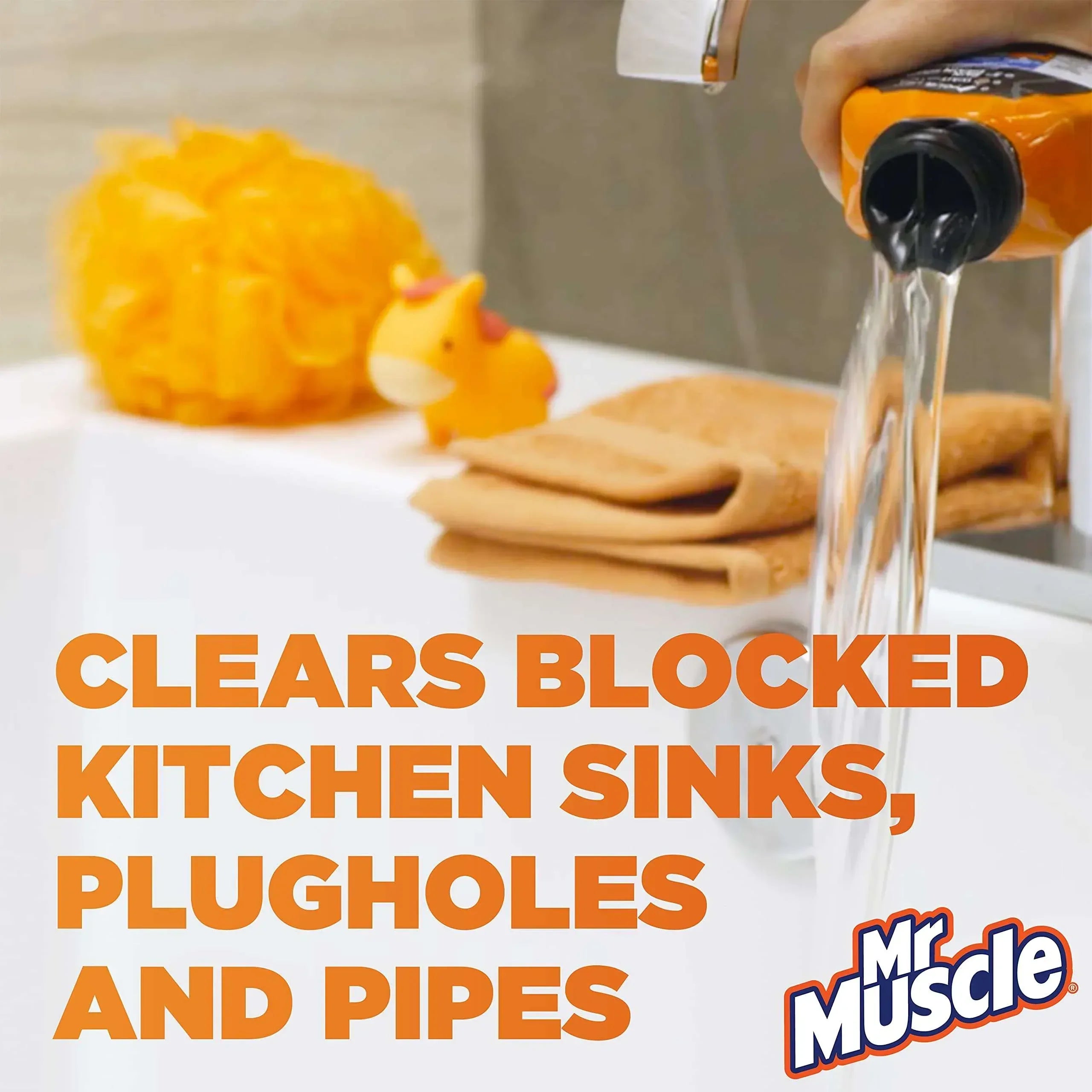 Orange Mr. Muscle drain cleaner bottle pouring clear liquid into kitchen sink