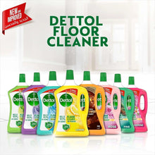 Assorted floor cleaner bottles lineup, including green pine 1.8L bottles with caps