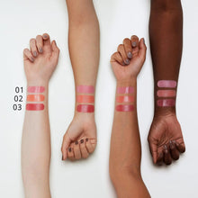 Pink blush balm swatches on wrists and forearms, showing different shades
