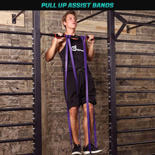 Purple assist band loops held in hands during assisted pull-up exercise
