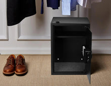Black electronic security safe with open door and side keypad lock