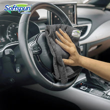 Grey microfiber cloth wrapped around a steering wheel