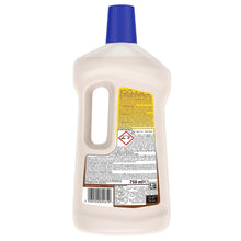 Pledge wood floor cleaner bottle with blue cap, back label, 750 ml, barcode visible.