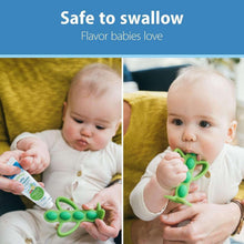 Baby holds green silicone toothbrush with fluoride-free toothpaste, safe to swallow