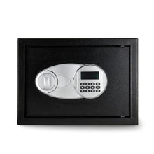 Black security safe front panel with dial handle and digital keypad