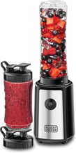 Sports blender with black base and two bottles, one filled with berry smoothie