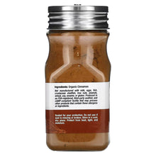 Saigon cinnamon powder jar with metal lid, back label and brown spice powder