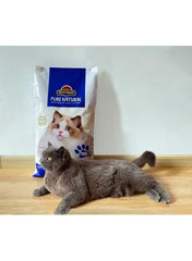 Bentonite cat litter bag with lemon scent, shown beside lying cat, blue top label