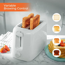 White 2-slice toaster with bread slices in slots and browning control knob