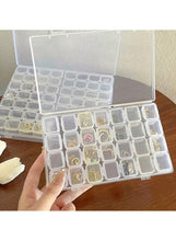 Clear plastic storage box with hinged lid and grid compartments for small items
