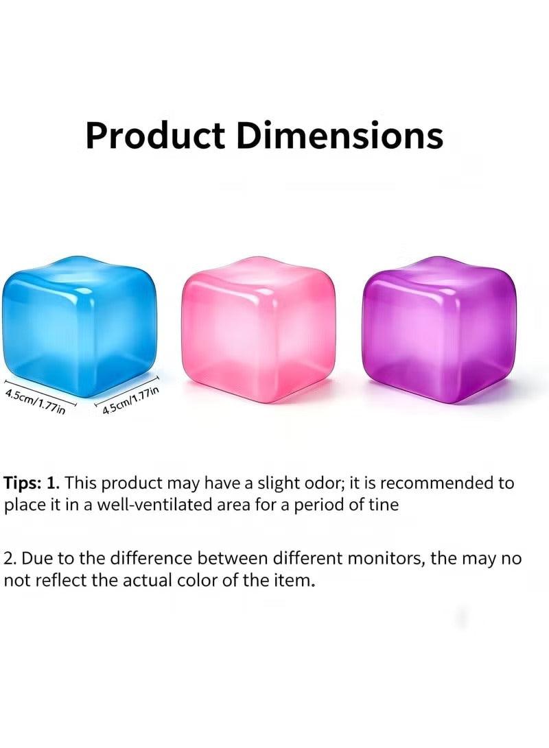 Three cube stress toys in blue, pink, and purple with rounded edges