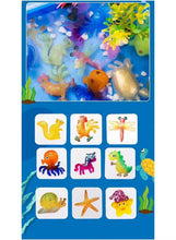 Water art stencil guide showing finished sea animal pictures on a grid sheet