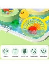 Water art play tray with yellow net, rubber duck, and colorful sea animal toys
