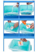 Water art kit showing hands pouring water into a blue-green tray and adding paint
