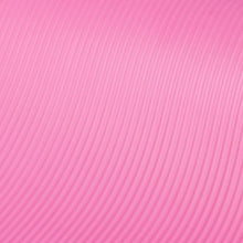 Pink yoga mat close-up of ribbed textured surface
