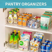 Clear pantry storage bins on a shelf, open tops with packaged goods inside