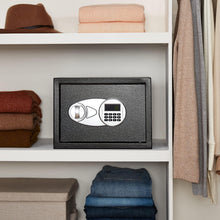 Black wall shelf safe with digital keypad, door closed in a cabinet niche