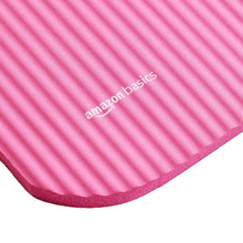 Pink yoga mat corner with textured top and thicker foam edge