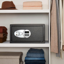 Black steel security safe inside a closet shelf with digital keypad
