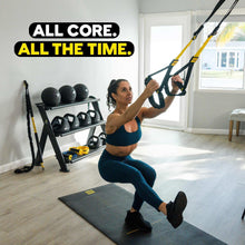 Suspension trainer straps with yellow accents and attached harness for full-body use