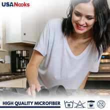 Microfiber cleaning cloth wiping a kitchen countertop or sink area