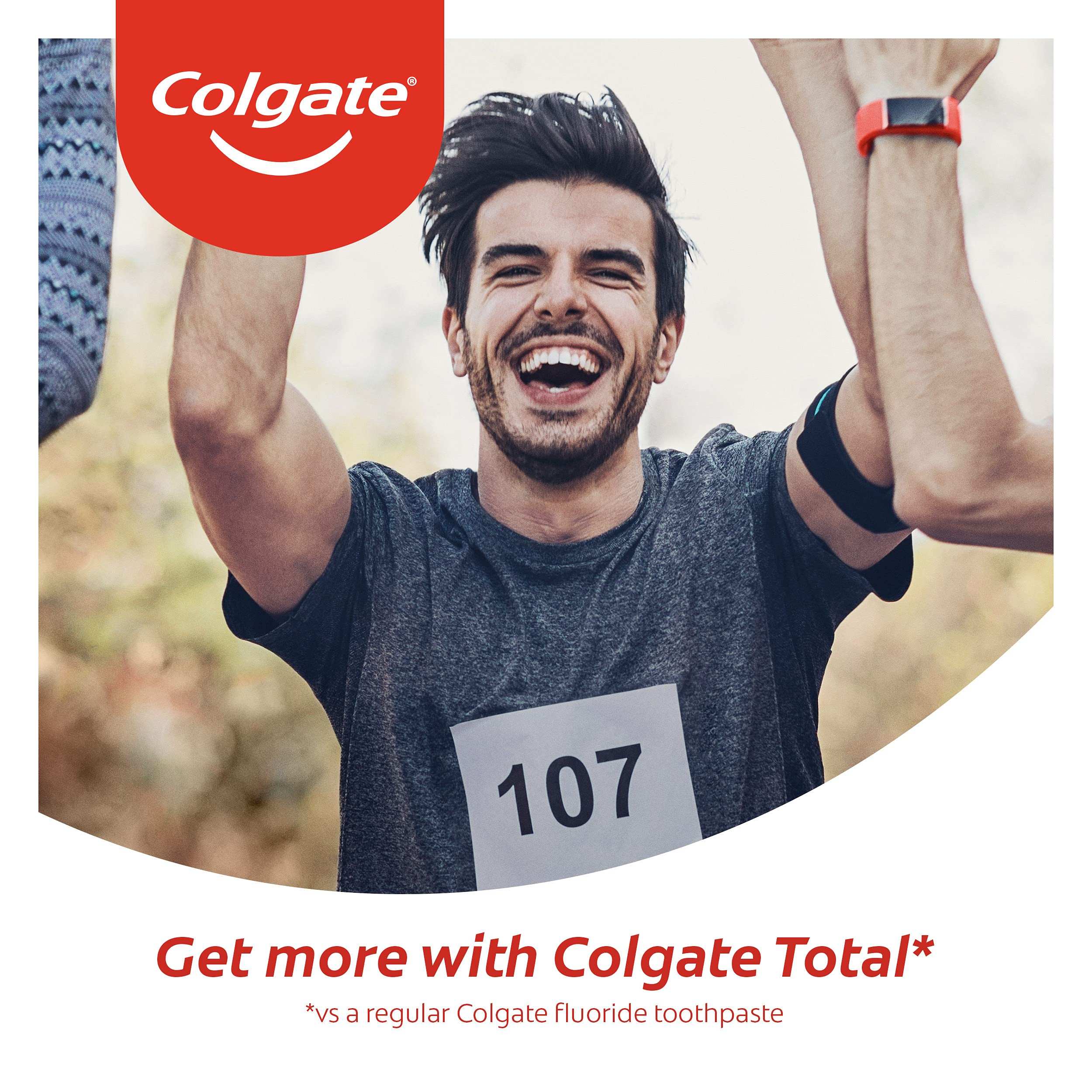 Happy male runner celebrating finish with bib 107 in Colgate ad promoting Colgate Total Clean Mint Toothpaste
