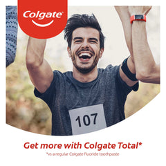 Happy male runner celebrating finish with bib 107 in Colgate ad promoting Colgate Total Clean Mint Toothpaste