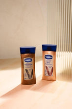 Vaseline vanilla glow body oil bottles, 200 ml, blue caps, two-pack view