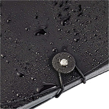 Black expanding file folder cover with water-resistant texture and tied strap