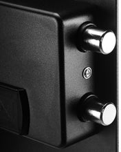 Black safe lock hardware close-up with two round bolts and metal key cylinder
