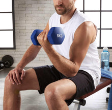 Blue 5KG neoprene dumbbell held during arm exercise.