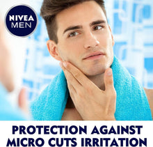 NIVEA MEN after shave lotion: man with hand on cheek, blue towel