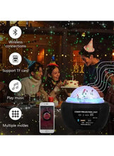 Star projection night light projector with glowing dome, shown with a smartphone control