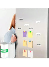 Color note papers pinned on a wall with a tape dispenser and printer output