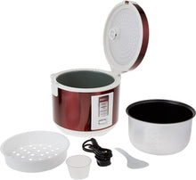 Red electric rice cooker open with non-stick inner pot, lid, and accessories