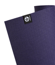 Manduka X yoga mat, purple textured surface with corner eco logo