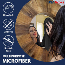 Microfiber cleaning cloth being wiped across a mirror or glass surface