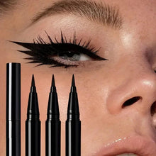 Black liquid eyeliner set with multiple pens and bold winged eyeliner on eye