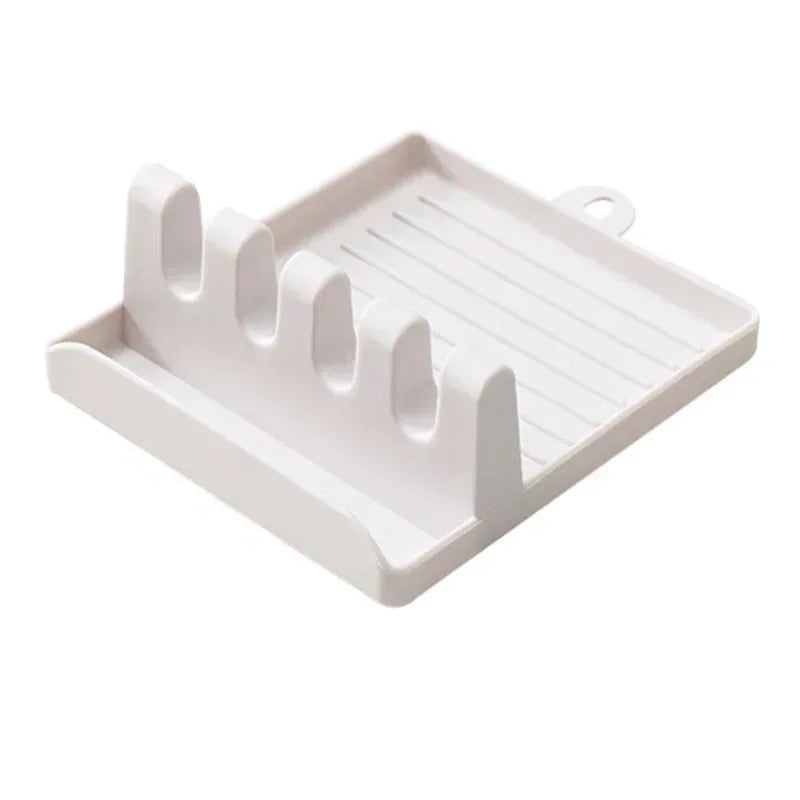 White plastic utensil rest organizer tray with four utensil slots