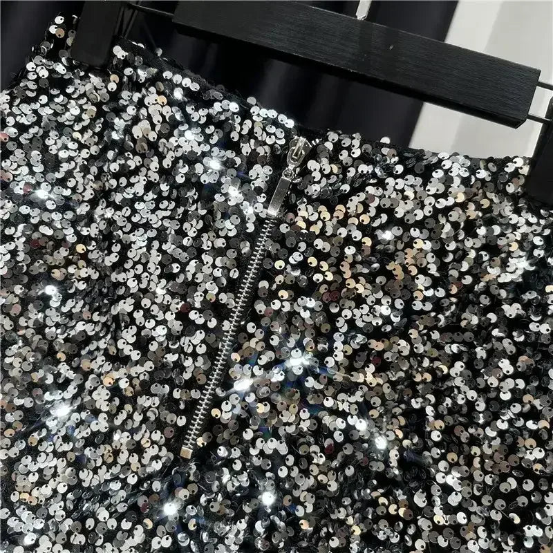 Silver sequined shorts close-up with front zipper and dense round sequin pattern