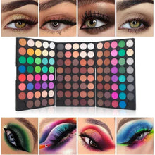 Colorful pressed eyeshadow palette with many round pans and mixed matte and glitter shades