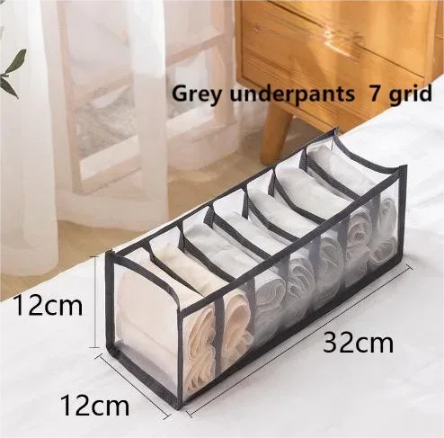 Foldable drawer organizer box with gray 7-compartment grid, holds folded underwear