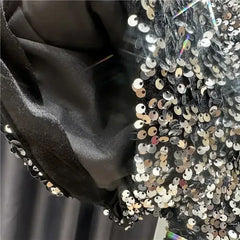 Dark panel and silver sequined shorts detail with high-shine textured surface