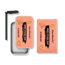 Eyebrow styling soap with brush and two orange product boxes