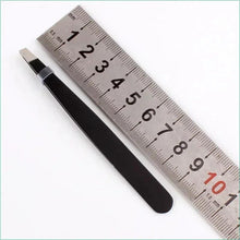 Black slant-tip eyebrow tweezer with ruler measurement.