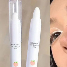 Highlight eyeshadow pen with clear cap and applied shimmer on under-eye area