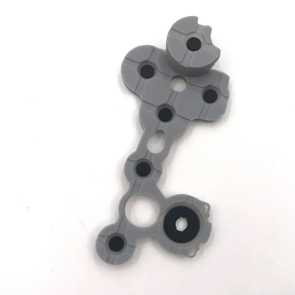 Conductive d-pad contact rubber button, gray with black circular contact and pivot