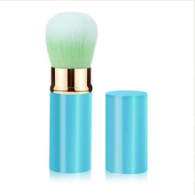 Retractable makeup brush with green-tinted bristles and blue retractable handle