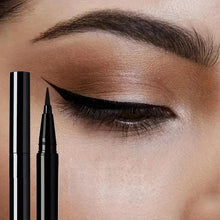 Black liquid eyeliner set with three applicators and winged eyeliner on eye closeup